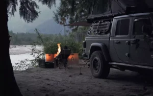 Camping with a Jeep Wrangler enjoying the warmth of an Overland Fire Pit