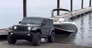 Can a Jeep Wrangler tow a boat? Yes, Here is a picture of a Jeep Wrangler Rubicon Towing a Boat