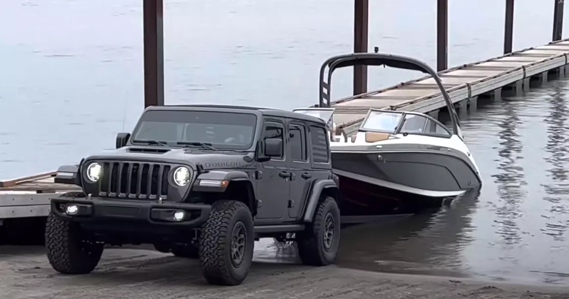 Can a Jeep Wrangler tow a boat? Yes, Here is a picture of a Jeep Wrangler Rubicon Towing a Boat