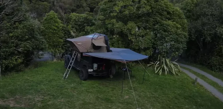 Jeep Wrangler Overlanding gear setup in the middle of the forest