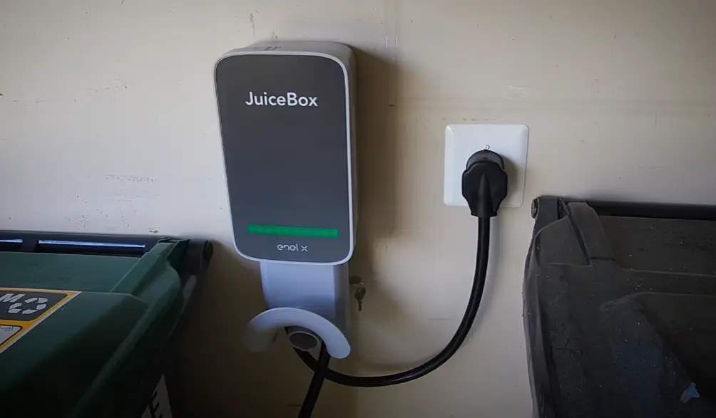 JuiceBox 40 Smart Charger Installed in a corner of our garage thanks to its long 25ft charging cable
