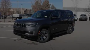 A luxurious Jeep Wagoneer full-size SUV, highlighting its spaciousness and elegance on a suburban street.